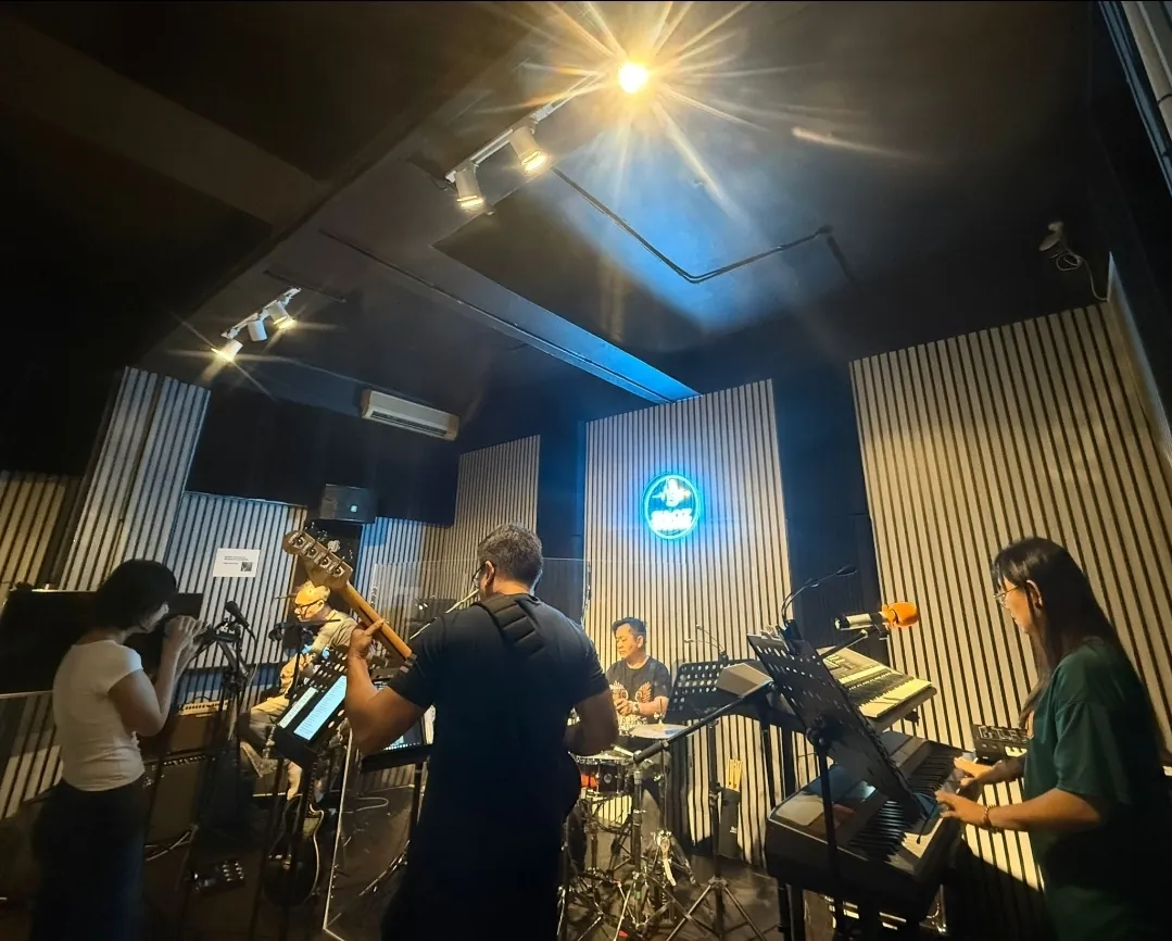 A band rehearsing in the studio