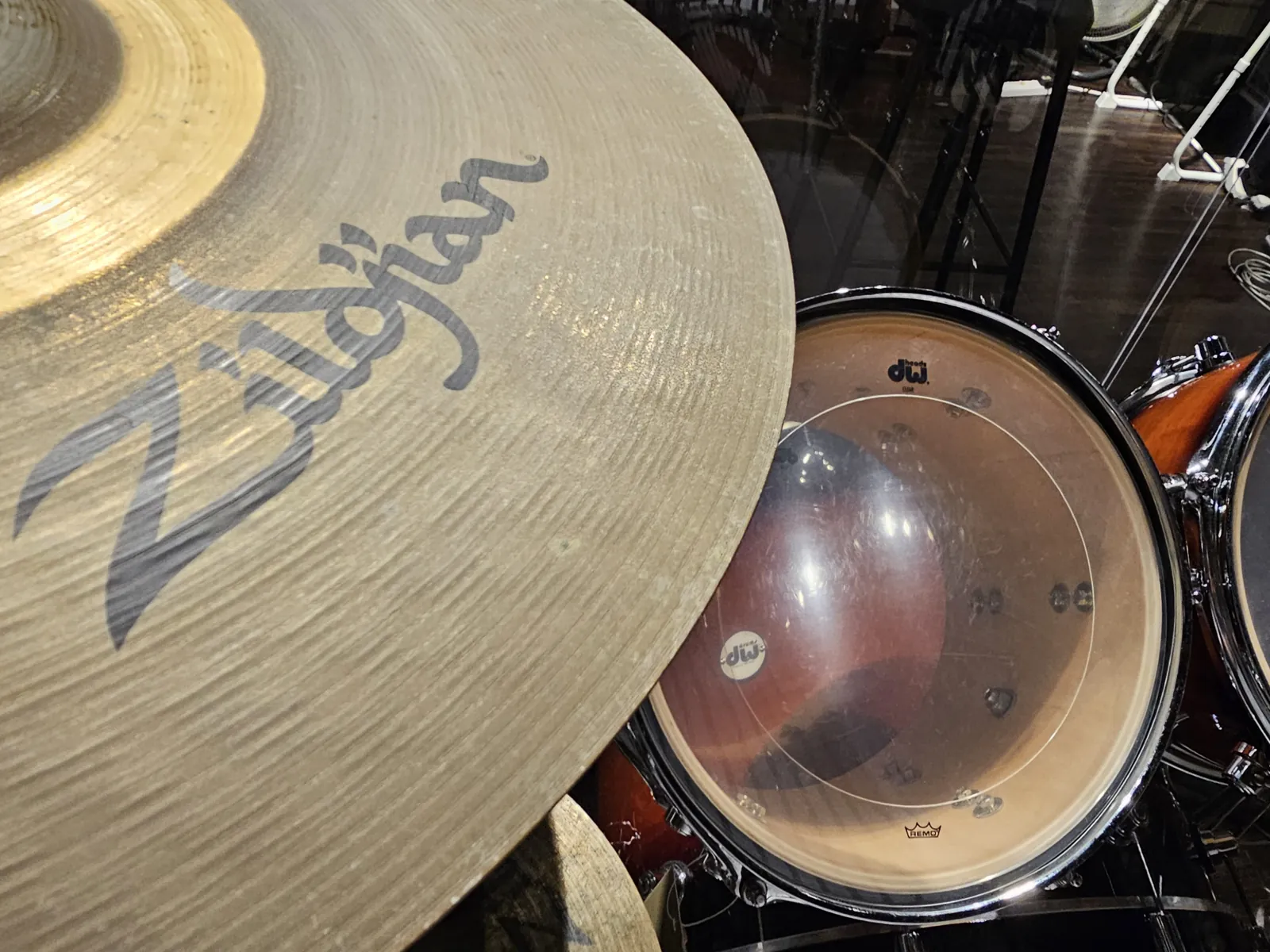 Close-up of a Zildjian cymbal over the DW toms